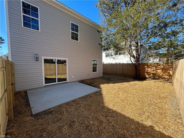 back of property with a patio