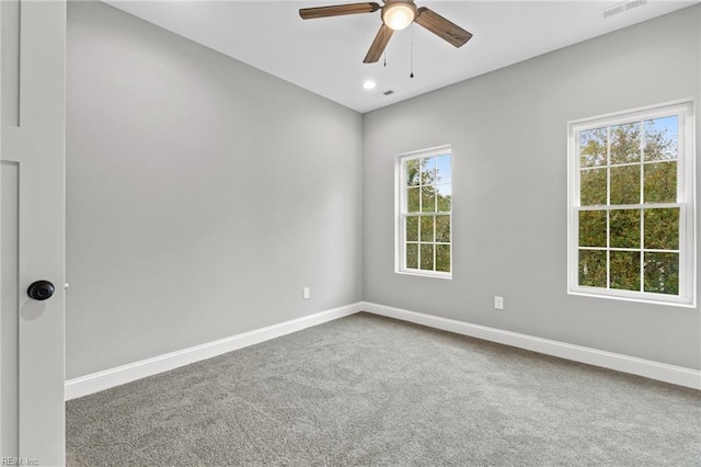 spare room with ceiling fan and carpet flooring