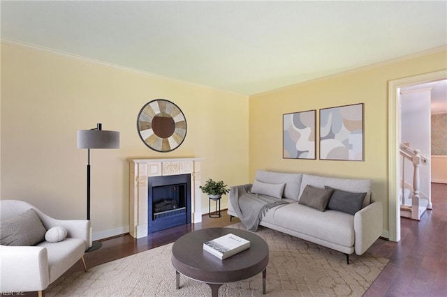 living room featuring crown molding and dark hardwood / wood-style flooring