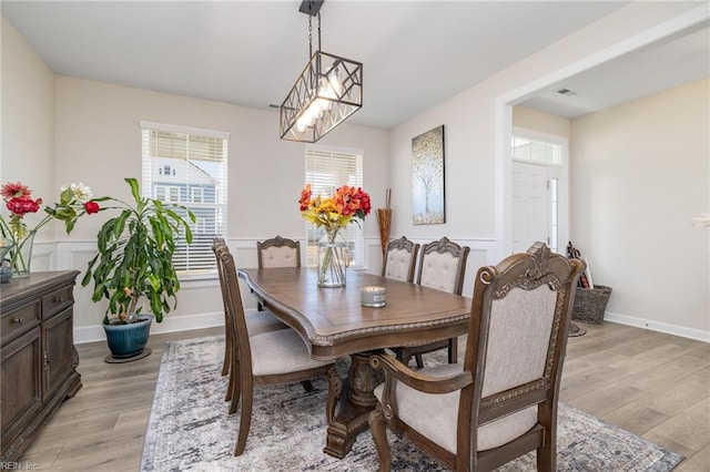 dining space with light hardwood / wood-style floors