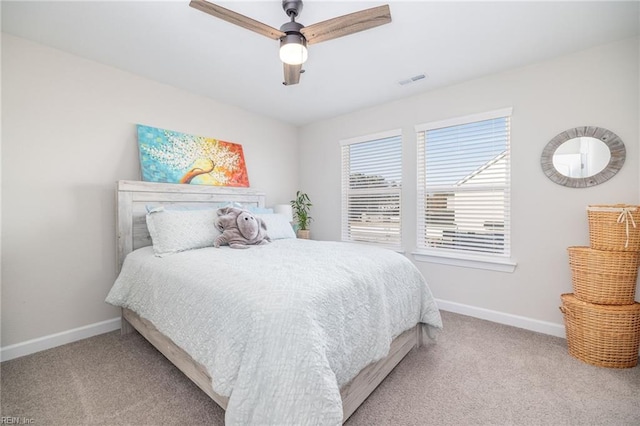 bedroom with ceiling fan and light carpet