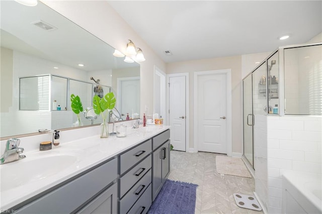 bathroom with shower with separate bathtub and vanity