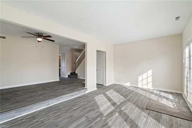 unfurnished room featuring dark hardwood / wood-style flooring and ceiling fan