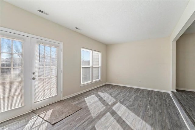 interior space featuring wood-type flooring and french doors