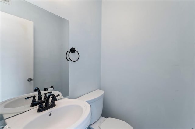 bathroom featuring sink and toilet