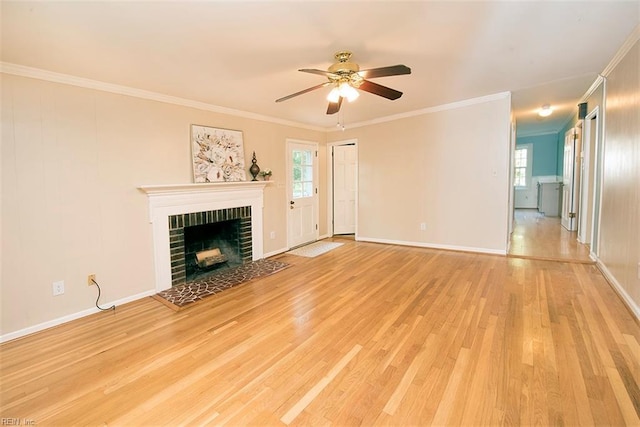 unfurnished living room with crown molding, ceiling fan, a fireplace, and light wood-type flooring