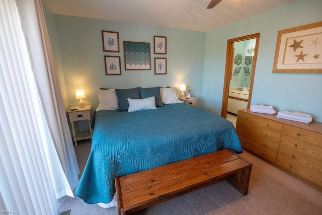 bedroom featuring ensuite bathroom and carpet floors