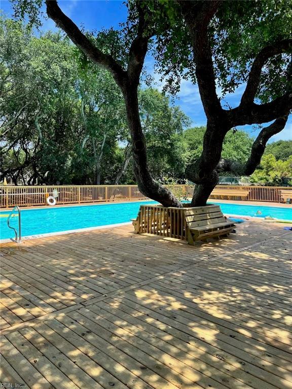 view of pool with a wooden deck