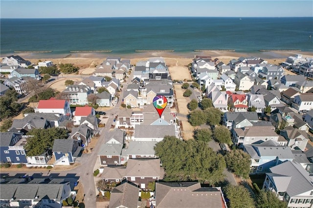 birds eye view of property featuring a water view and a view of the beach