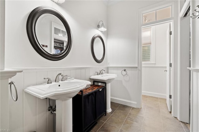 bathroom with double sink and tile patterned floors