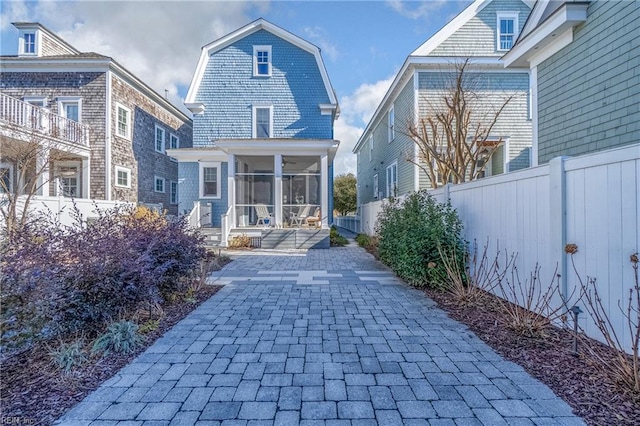 back of house with a patio and a sunroom