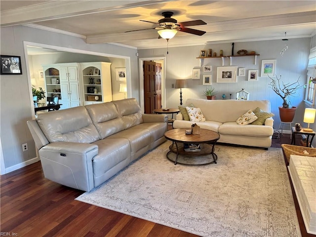 living room featuring dark wood-type flooring, ceiling fan, and ornamental molding