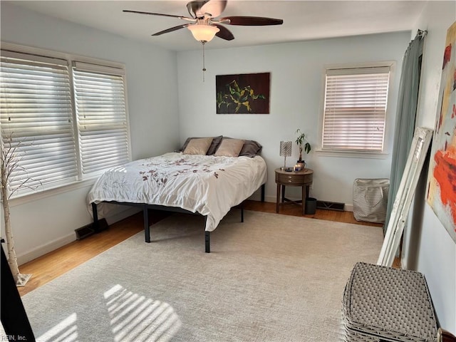 bedroom featuring ceiling fan and light hardwood / wood-style flooring