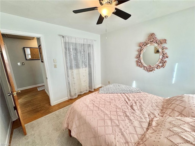 bedroom with light hardwood / wood-style flooring and ceiling fan