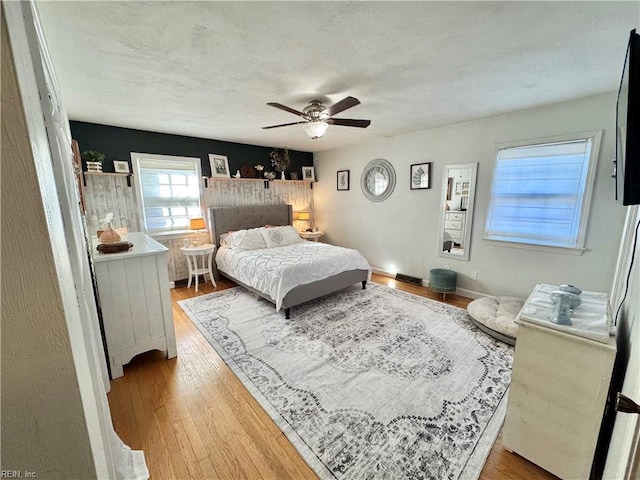 bedroom featuring ceiling fan and hardwood / wood-style floors