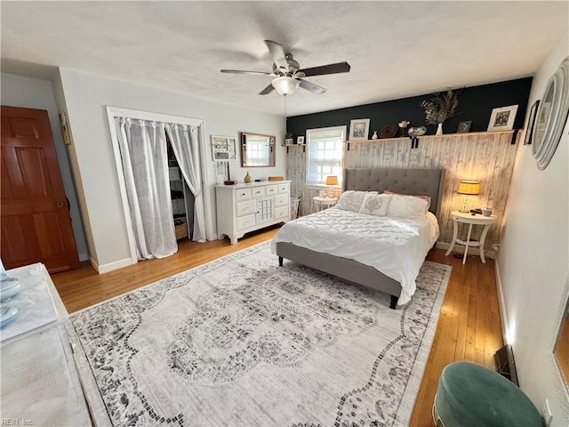 bedroom featuring light hardwood / wood-style flooring and ceiling fan