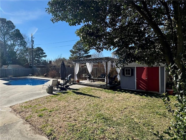 view of yard with a fenced in pool, a storage unit, a pergola, and a patio