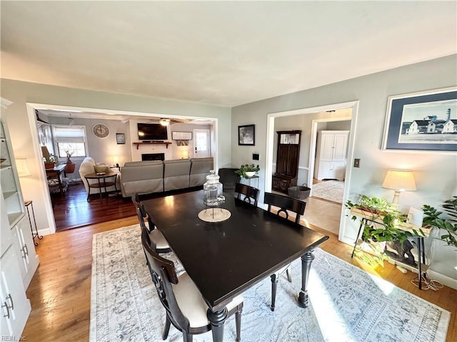 dining space with hardwood / wood-style floors