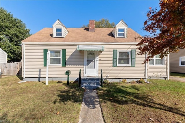 new england style home with a front yard