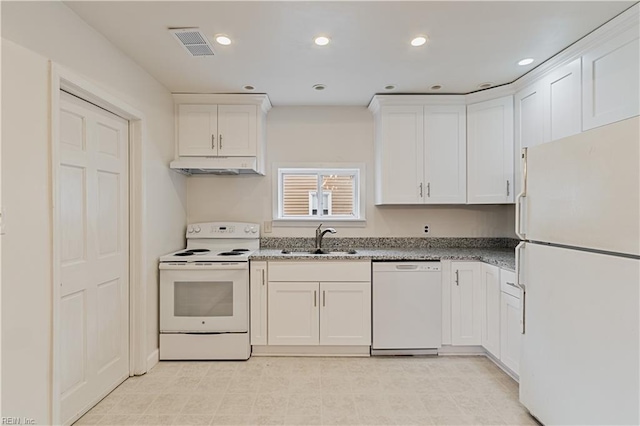 kitchen featuring sink, white cabinets, and white appliances