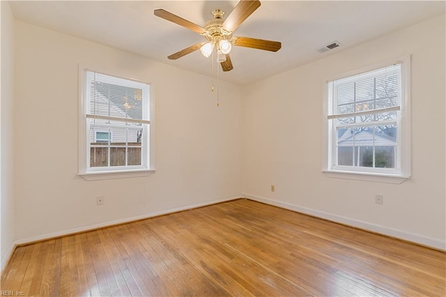 empty room featuring ceiling fan and light hardwood / wood-style floors