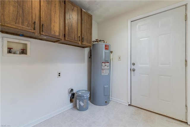 laundry room featuring water heater, washer hookup, and cabinets