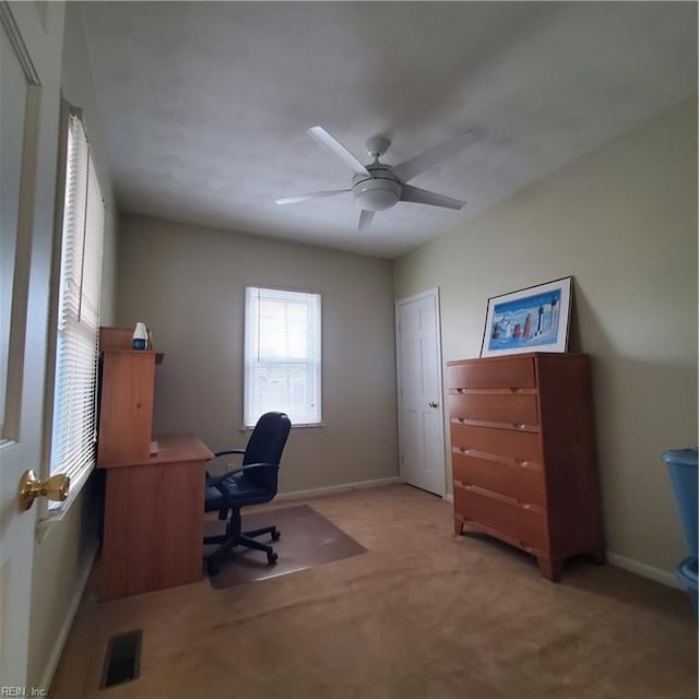 office area with light colored carpet and ceiling fan