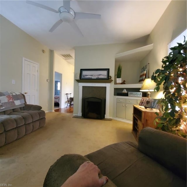 living room with ceiling fan and light carpet