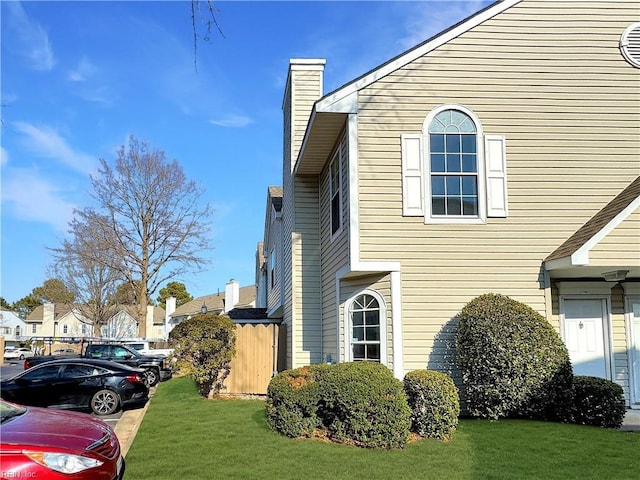 view of side of home featuring a yard