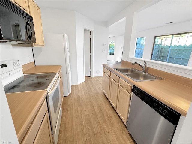 kitchen featuring light brown cabinetry, sink, dishwasher, and white range with electric cooktop