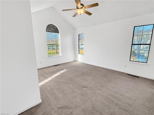 carpeted spare room with lofted ceiling and ceiling fan