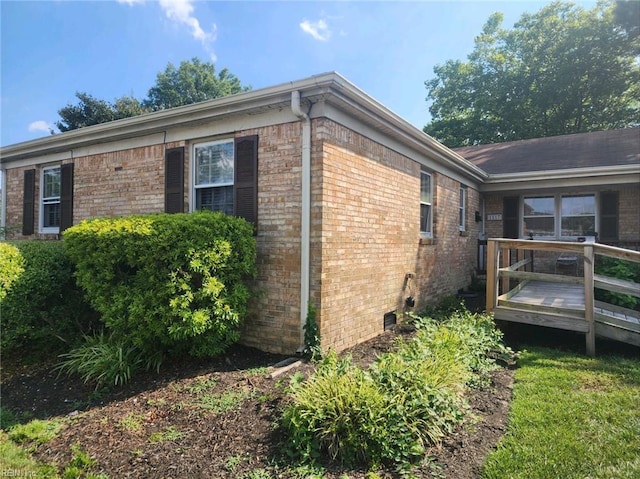 view of side of property with a deck