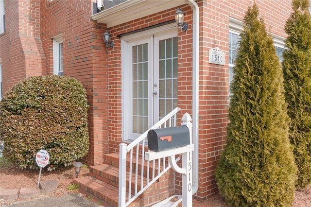 view of exterior entry featuring french doors