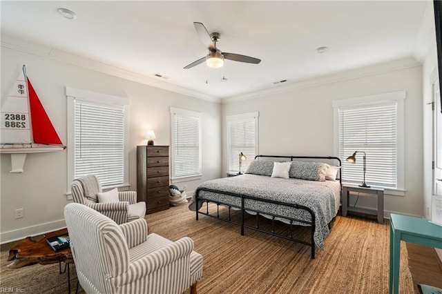 bedroom with wood-type flooring, ornamental molding, and ceiling fan