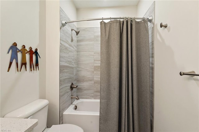 bathroom with shower / bath combo and toilet