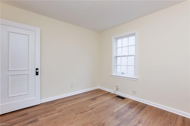 unfurnished room featuring light wood-type flooring