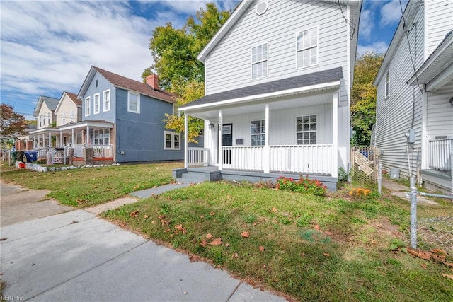 view of front of property with a front lawn and covered porch