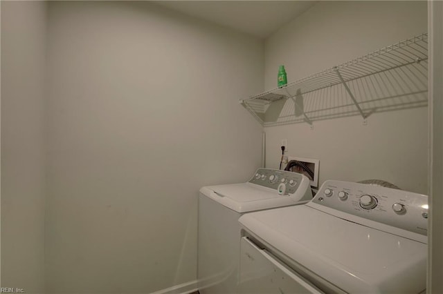 washroom featuring washer and clothes dryer