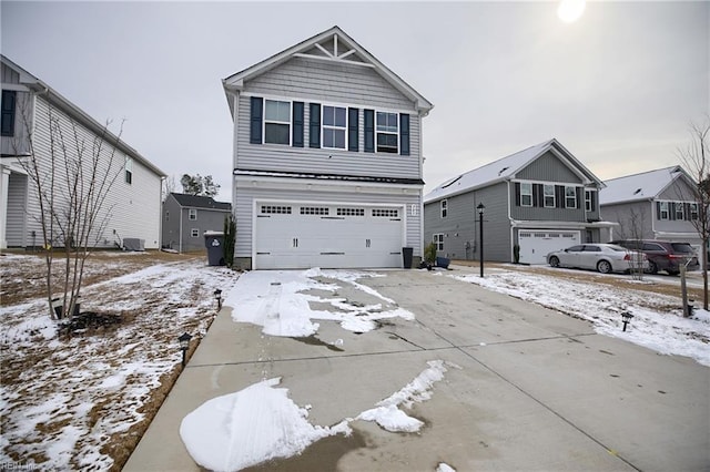 view of front of house with a garage and central air condition unit