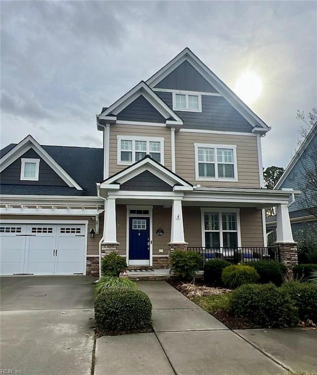 craftsman house featuring a garage and covered porch