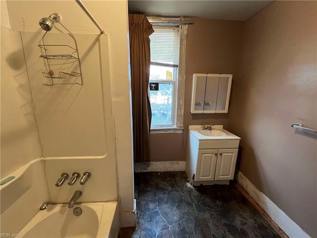 bathroom featuring shower / bathtub combination, vanity, and a wealth of natural light