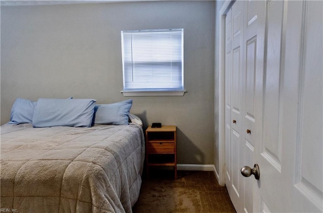 carpeted bedroom with a closet