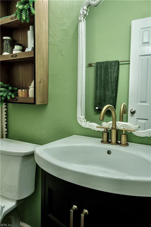 bathroom with vanity and toilet