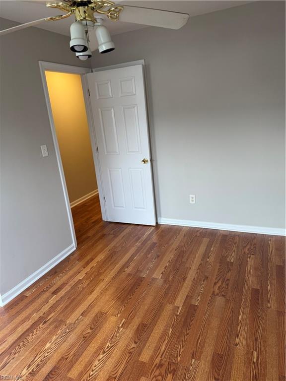 interior space with hardwood / wood-style flooring and ceiling fan