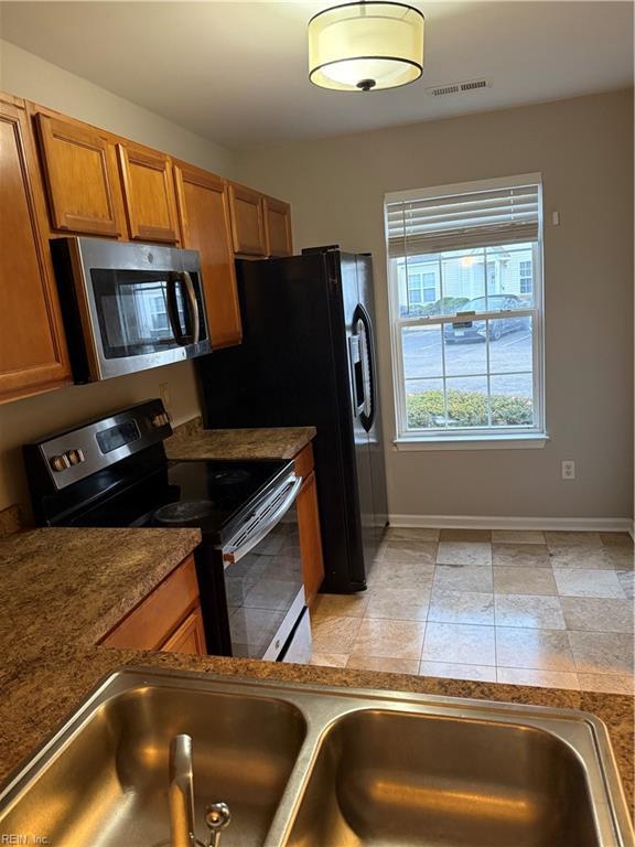 kitchen with appliances with stainless steel finishes and sink