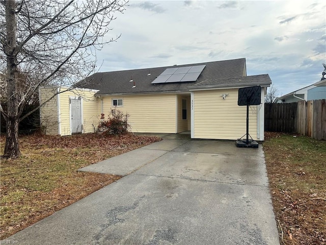 rear view of house with solar panels