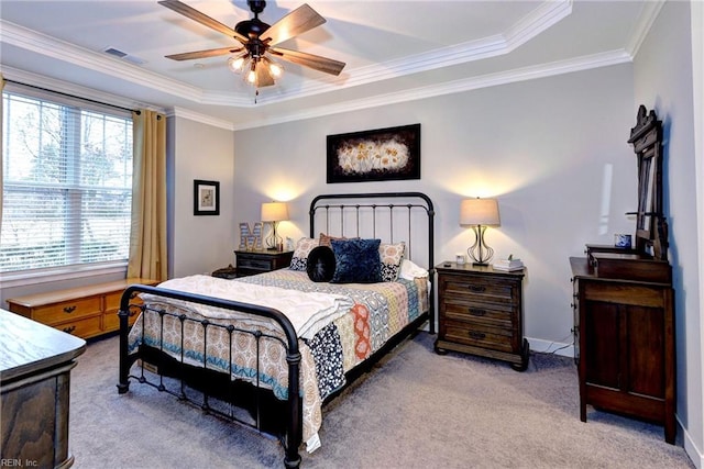 bedroom featuring crown molding, a raised ceiling, ceiling fan, and carpet flooring