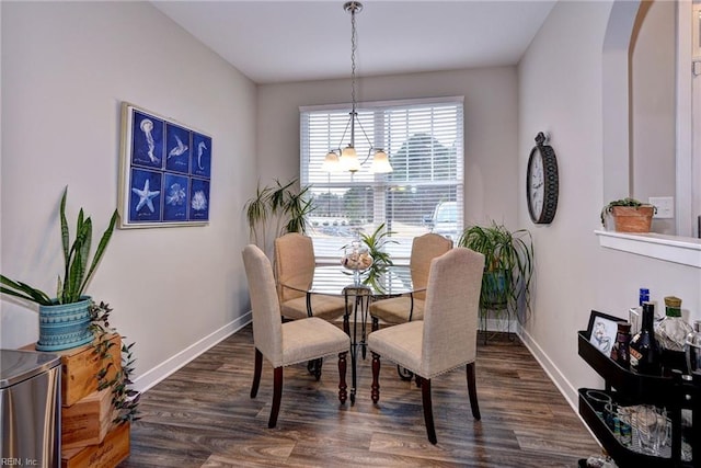 dining area featuring dark hardwood / wood-style flooring