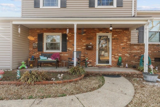 property entrance with covered porch