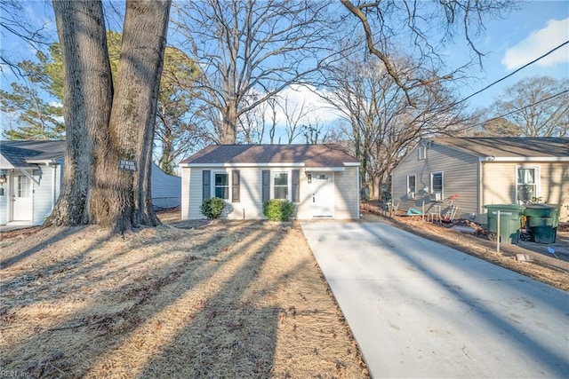 ranch-style home featuring an outbuilding